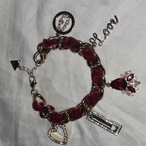 Guess red velvet and gold tone charm bracelet